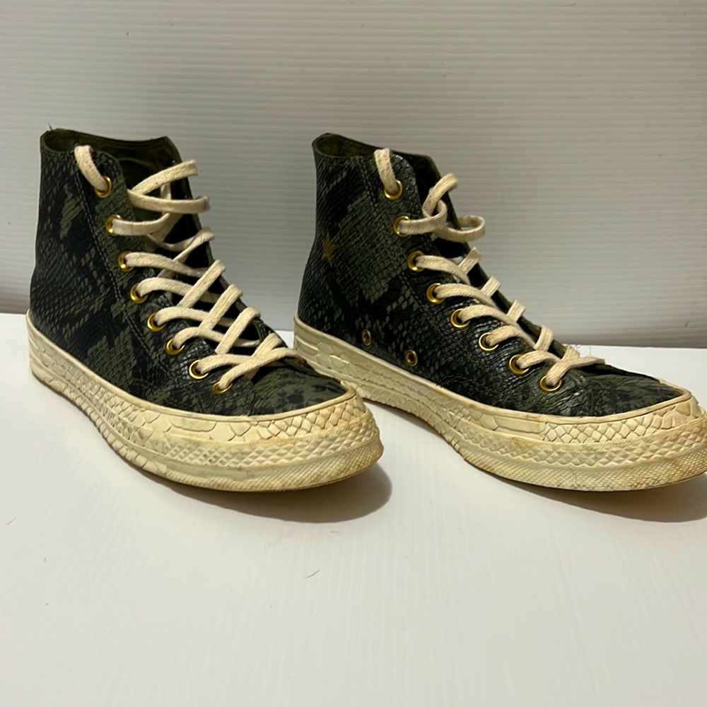 Size 8.5 Converse Hi-Tops with green snakeskin. In great used condition.